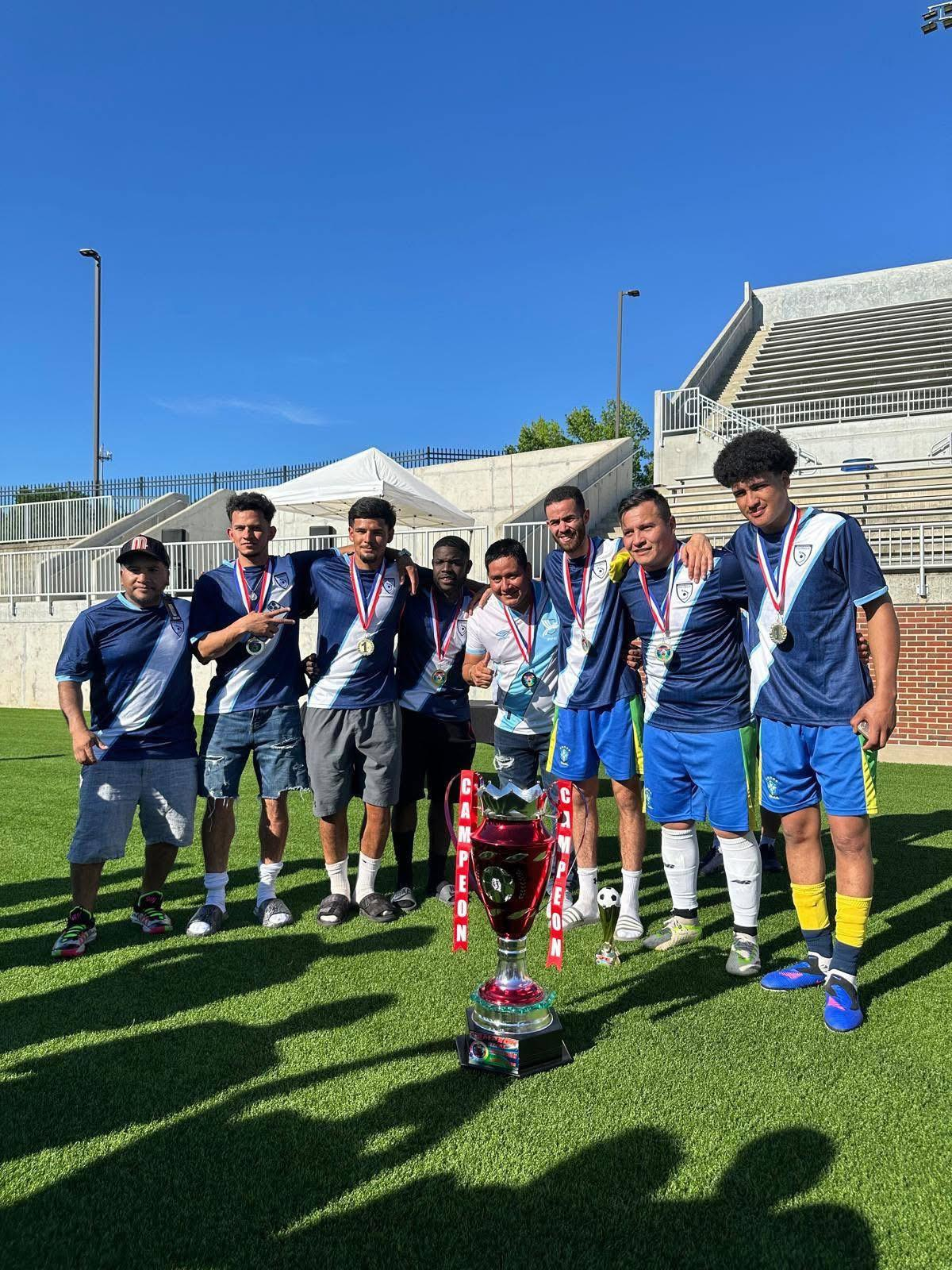Title-winning squad poses with the cup